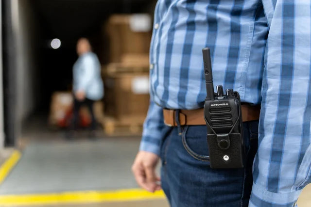 Man with a Motorola R2 on his belt