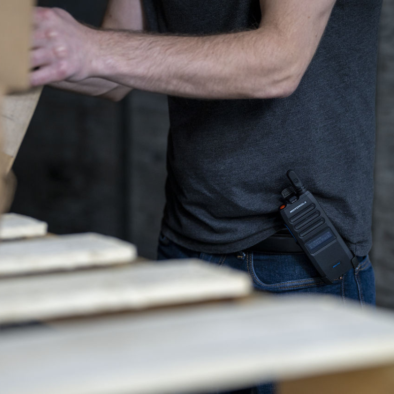 The Motorola TLK110 Poc radio on a mans belt