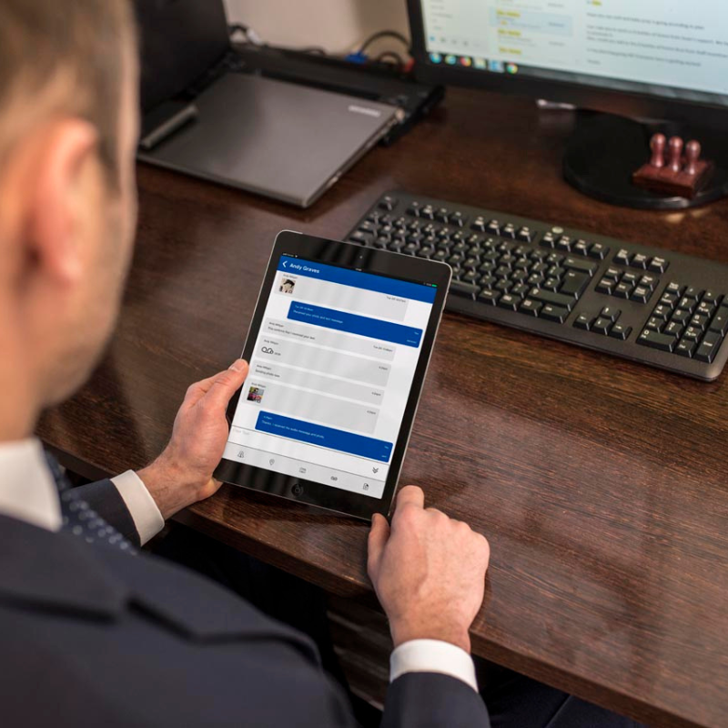 A man using the Motorola Wave app on a tablet