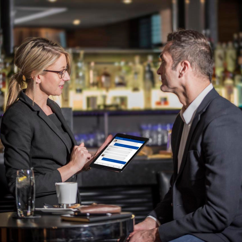 A woman using the Motorola Wave app on a tablet