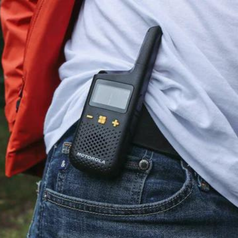 The Motorola XY185 attached to a persons belt