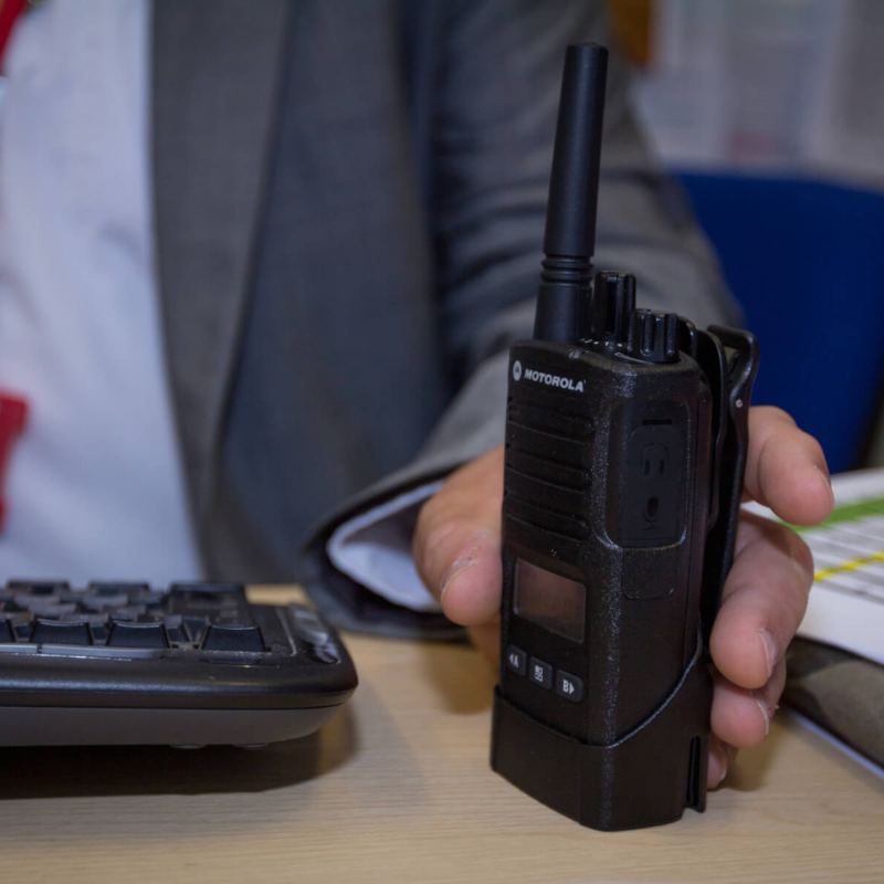 A man holding the Motorola XT460 on his desk