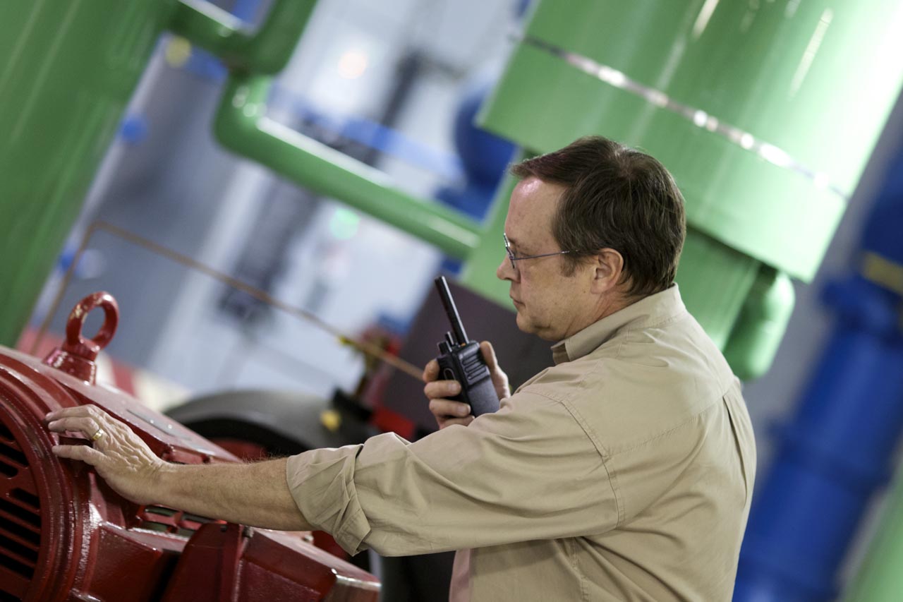 A man in a factory holding a DP4400e